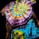 A short-sleeve tie-dye T-shirt with a large spiral mandala pattern in yellow, green, purple, pink, orange, and white, with a blue and yellow abstract section at the lower right, shown against a black background.