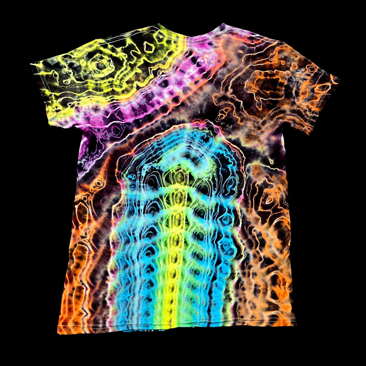 A short-sleeve crewneck t-shirt featuring a vibrant, psychedelic tie-dye pattern with a central rainbow gradient and wavy neon lines in yellow, green, blue, purple, and orange, displayed against a solid black background.