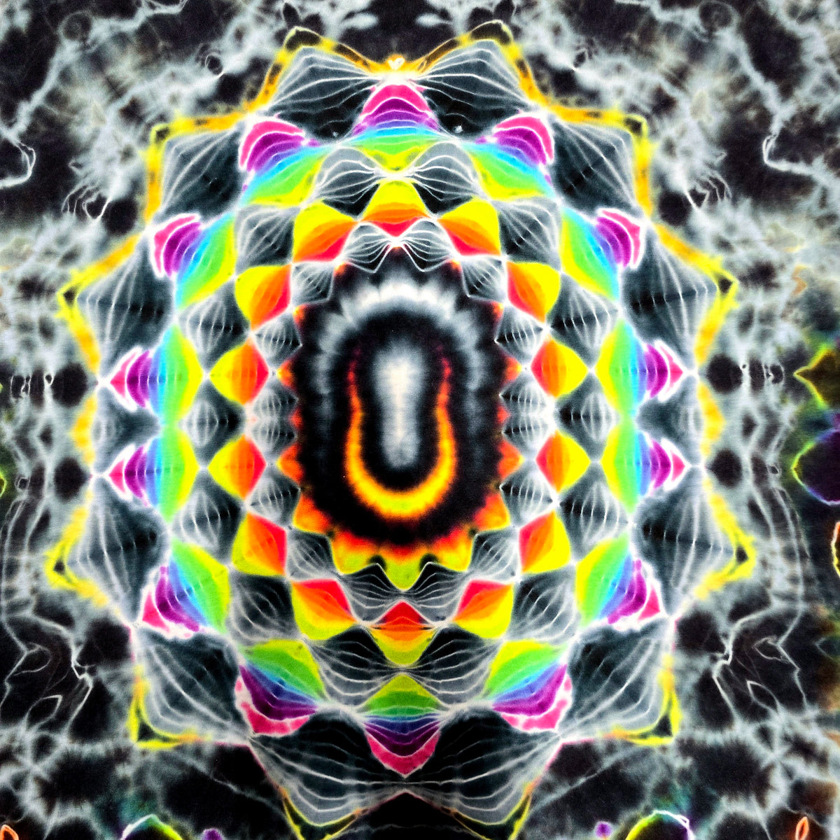 A highly symmetrical, psychedelic kaleidoscopic mandala pattern with concentric rings of neon yellow, orange, red, green, blue, and purple on a dark textured background.