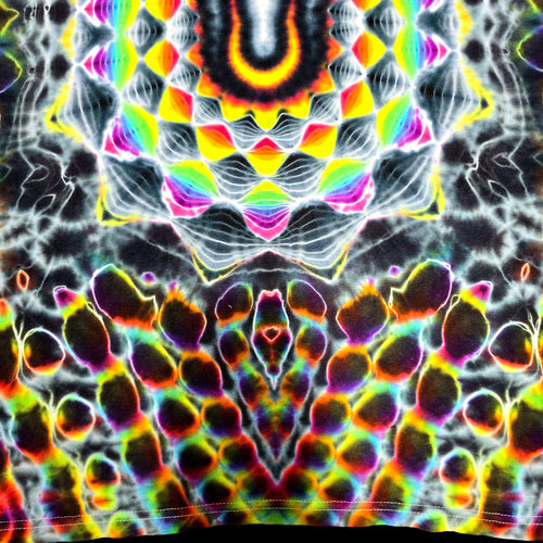 A close-up of a tie-dye fabric with a highly symmetrical, psychedelic pattern featuring neon rainbow colors on a black and white base.