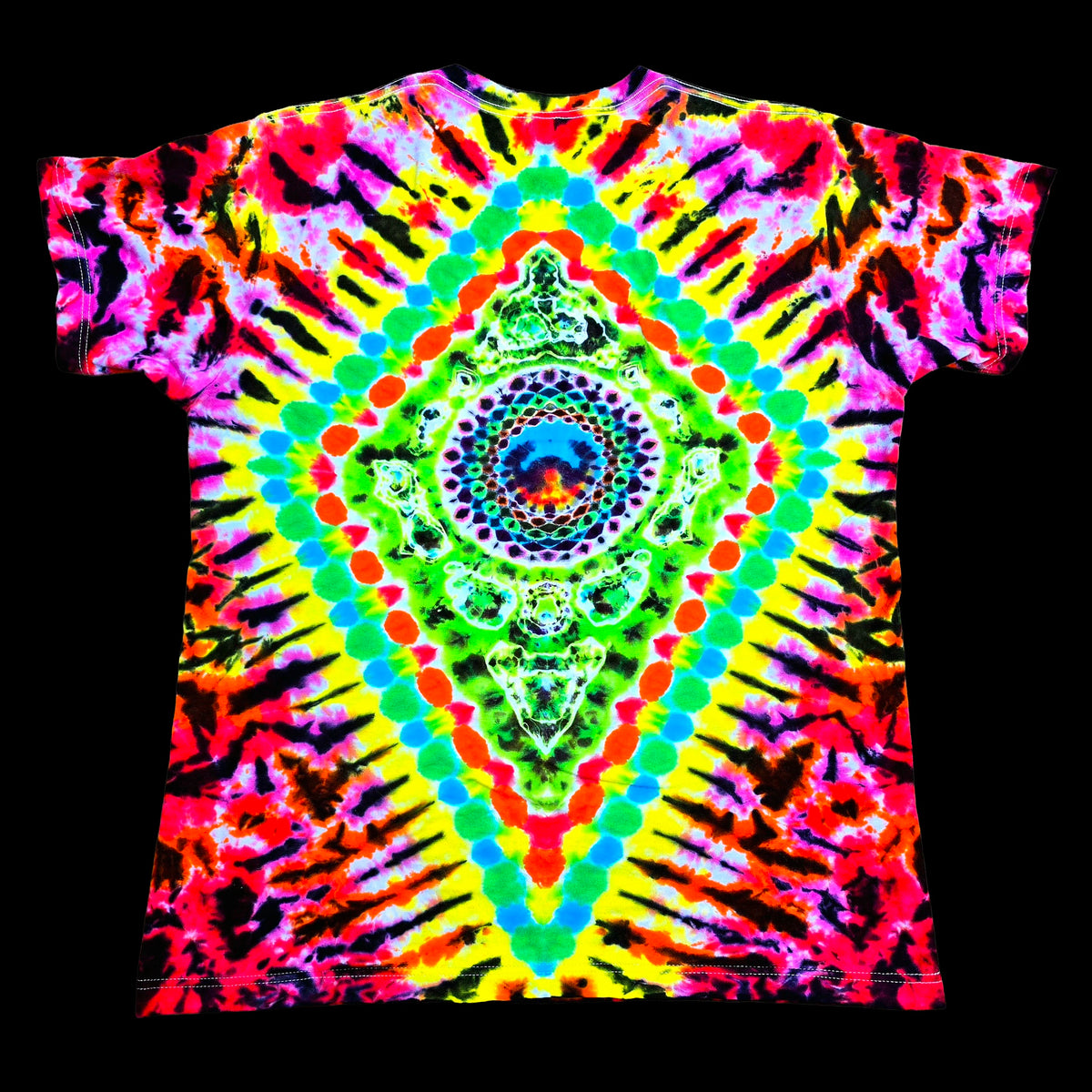 A short-sleeve crewneck t-shirt featuring a vibrant, psychedelic tie-dye pattern with a central mandala design. The shirt is covered in neon colors including pink, yellow, green, blue, orange, and purple in a symmetrical, radial burst pattern, presented flat against a solid black background.