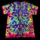 A short-sleeve crewneck t-shirt featuring a vibrant, symmetrical neon tie-dye pattern with purple, pink, yellow, blue, and green on a black background.