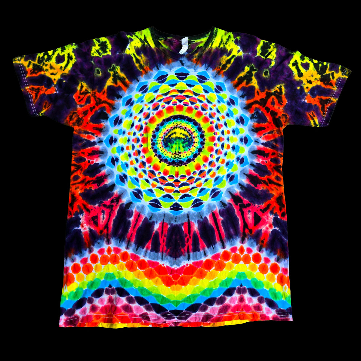 A short-sleeve tie-dye t-shirt featuring a vibrant, symmetrical mandala design with a rainbow spectrum of neon colors on a solid black background.