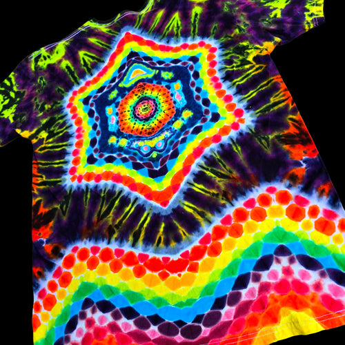 A short-sleeve tie-dye T-shirt with a highly vibrant, multicolor psychedelic design featuring concentric star and rainbow patterns on a black background.