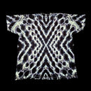 A short-sleeve t-shirt with an all-over abstract symmetrical pattern of glowing white and pale lavender circular and zigzag lines on a black background, shown flat against a solid black backdrop.