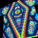 A close-up of a tie-dye t-shirt featuring a highly vibrant, psychedelic pattern with concentric circles and diamond-like shapes in neon blue, green, yellow, orange, and purple on a dark base.