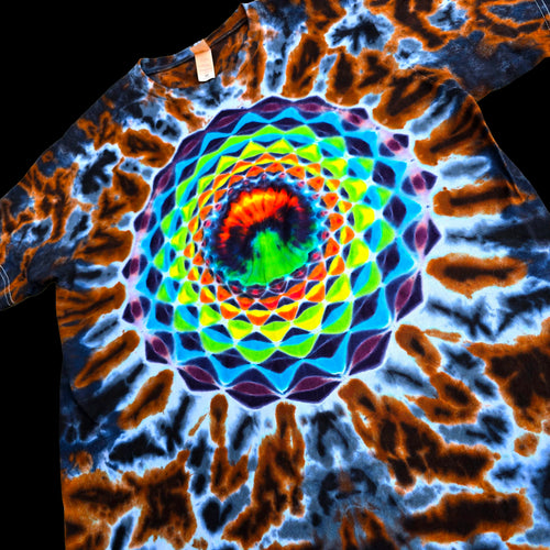 A short-sleeve tie-dye t-shirt featuring a vibrant, multicolored spiral mandala pattern in the center, surrounded by blue, brown, and orange tie-dye swirls.