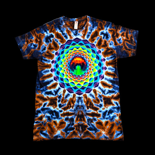 A short-sleeve crewneck t-shirt featuring a vibrant, symmetrical mandala design with a rainbow spiral pattern over a blue and orange tie-dye background.