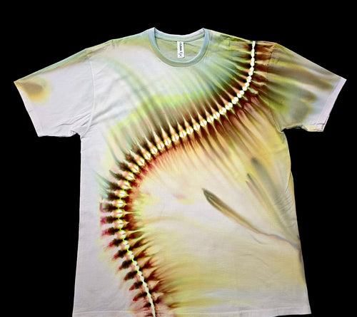 A short-sleeve crewneck t-shirt featuring a tie-dye baseball stitching pattern in yellow, green, and brown on a white base, shown against a solid black background.