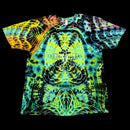 A short-sleeve crewneck t-shirt featuring a vibrant, symmetrical psychedelic tie-dye pattern with neon green, yellow, blue, and orange tones on a black background.