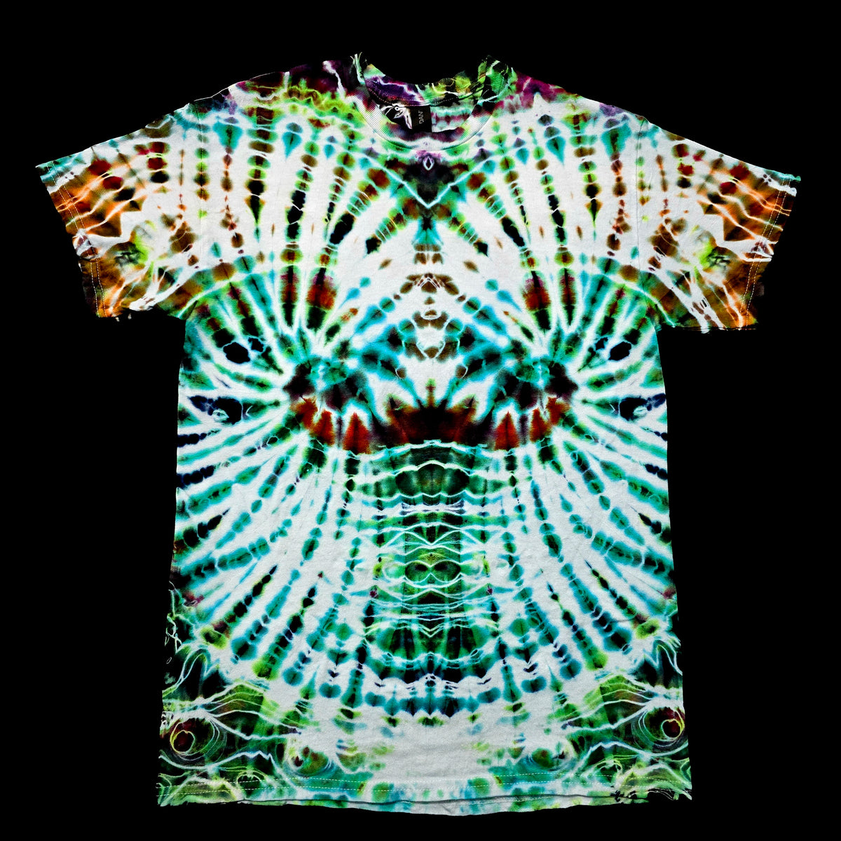 A short-sleeve tie-dye t-shirt with a highly symmetrical, psychedelic radial pattern in green, teal, white, and brown, displayed flat against a solid black background.