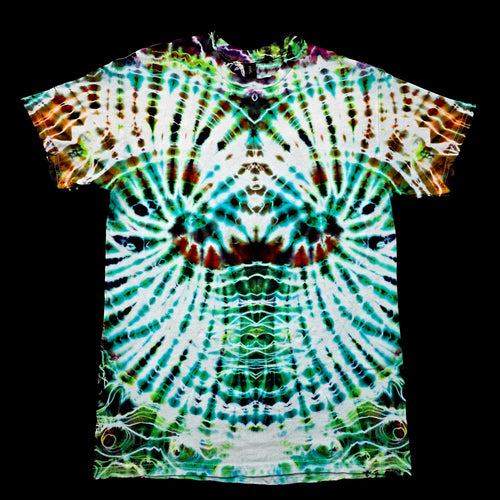 A short-sleeve tie-dye t-shirt with a highly symmetrical, psychedelic radial pattern in green, teal, white, and brown, displayed flat against a solid black background.