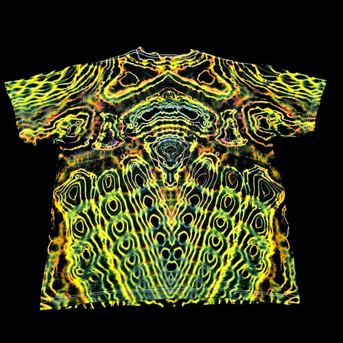 A short-sleeve crewneck t-shirt featuring a vibrant, symmetrical psychedelic pattern of neon yellow, lime green, and orange wavy lines over a black base, presented flat against a solid black background.