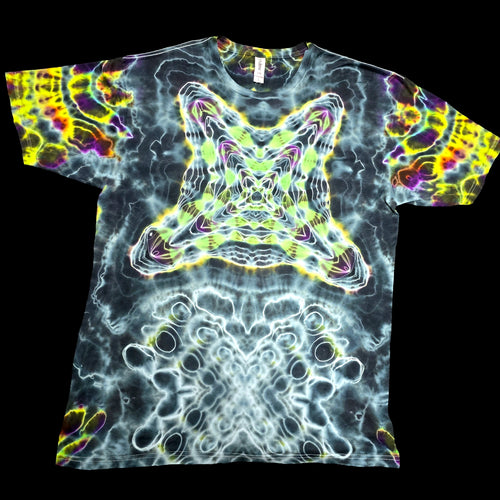 A short-sleeve crewneck t-shirt featuring a psychedelic, kaleidoscopic abstract pattern with a central star-like motif and swirling neon colors, displayed flat against a solid black background.