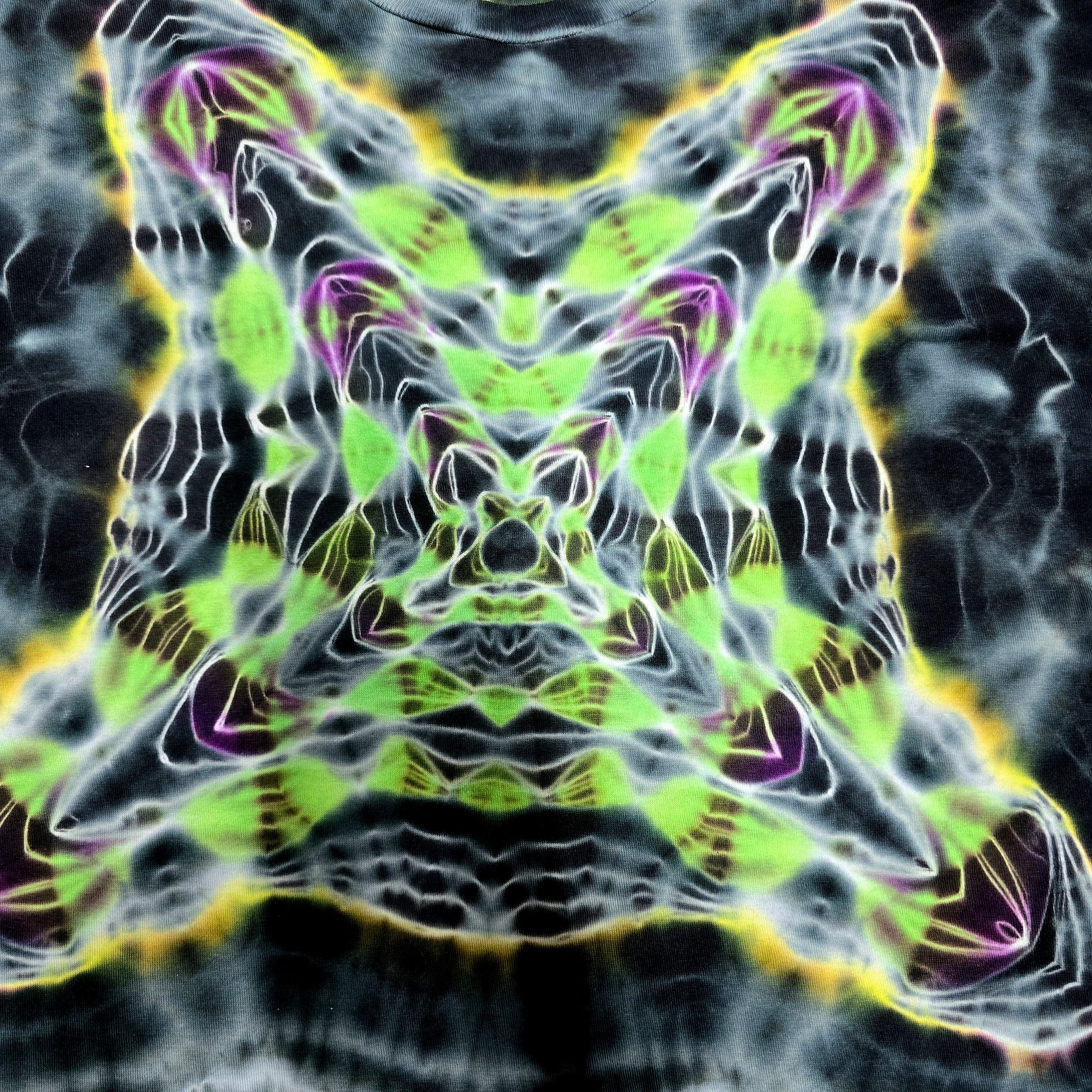 Abstract psychedelic artwork featuring a symmetrical, kaleidoscopic design with neon green, lime, purple, and yellow glowing lines over a dark gray and black textured background.