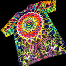 A short-sleeve tie-dye T-shirt with a large multicolor spiral mandala pattern on the front, shown against a solid black background.