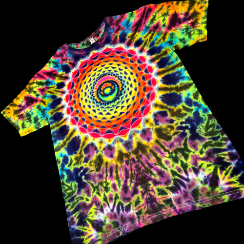 A short-sleeve tie-dye T-shirt with a large multicolor spiral mandala pattern on the front, shown against a solid black background.