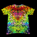 A short-sleeve crewneck t-shirt featuring a vibrant, symmetrical tie-dye pattern with neon green, yellow, pink, orange, purple, and blue colors radiating from the center, shown against a solid black background.