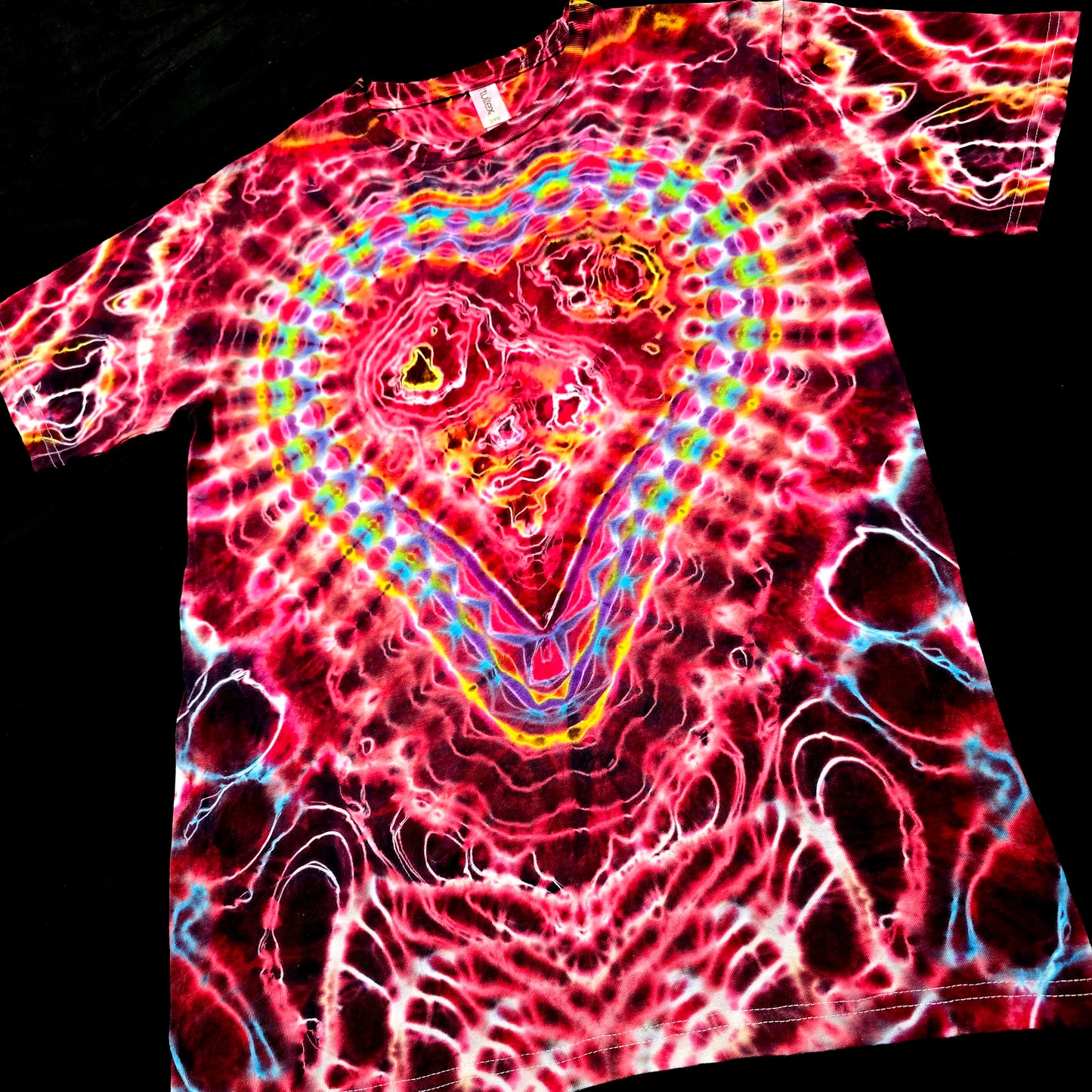 Angled front view highlighting the radiant heart mandala and layered red Valentine-inspired dye saturation