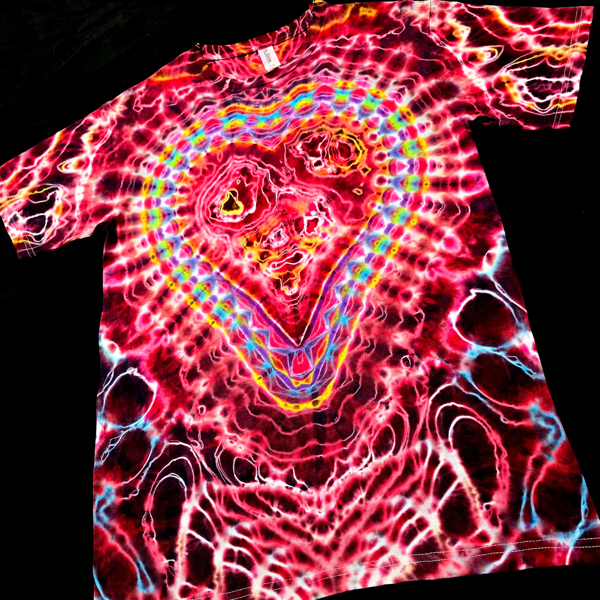 Angled front view highlighting the radiant heart mandala and layered red Valentine-inspired dye saturation