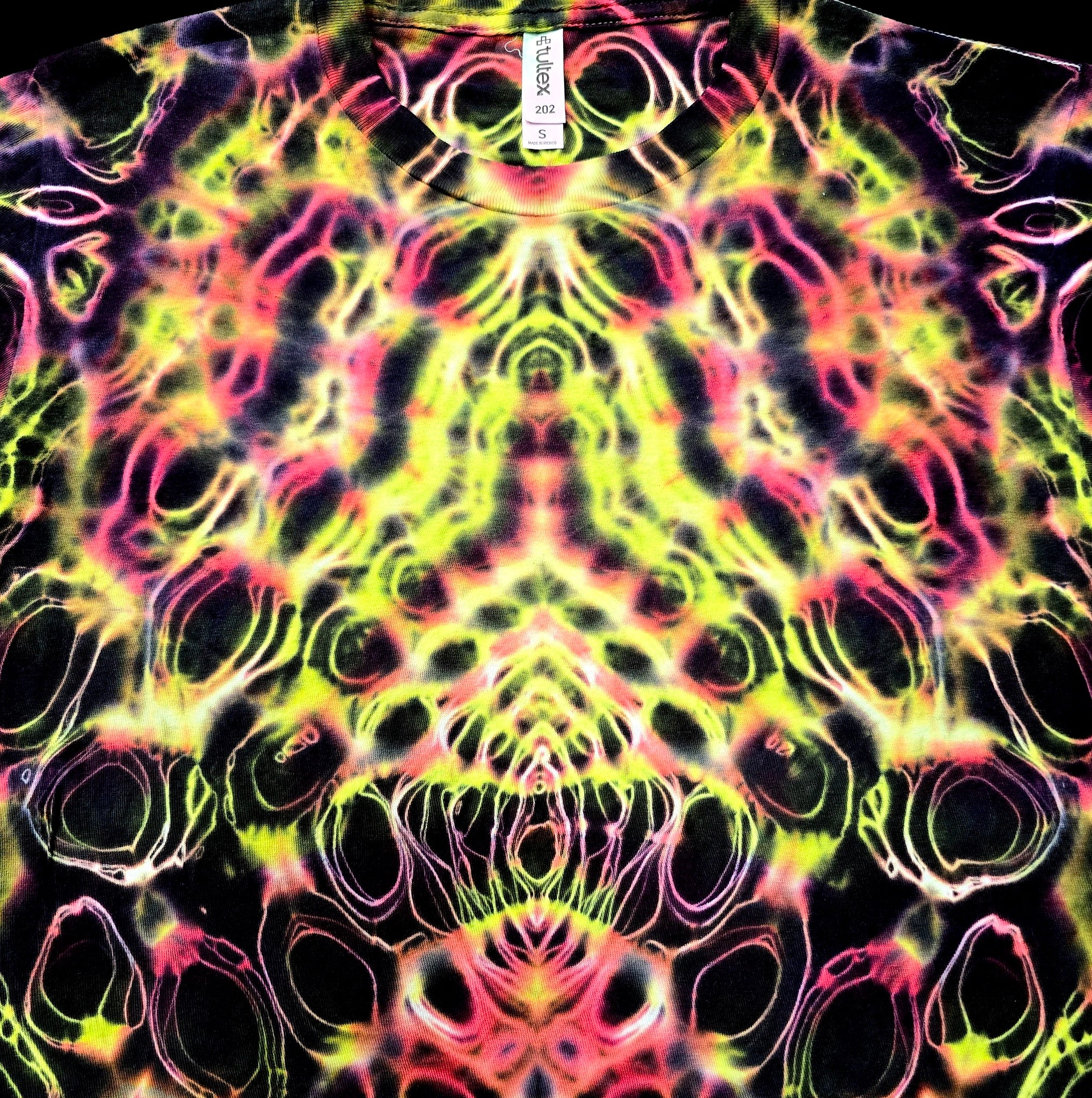 Colorful tie-dye pattern on a shirt with a brand label.