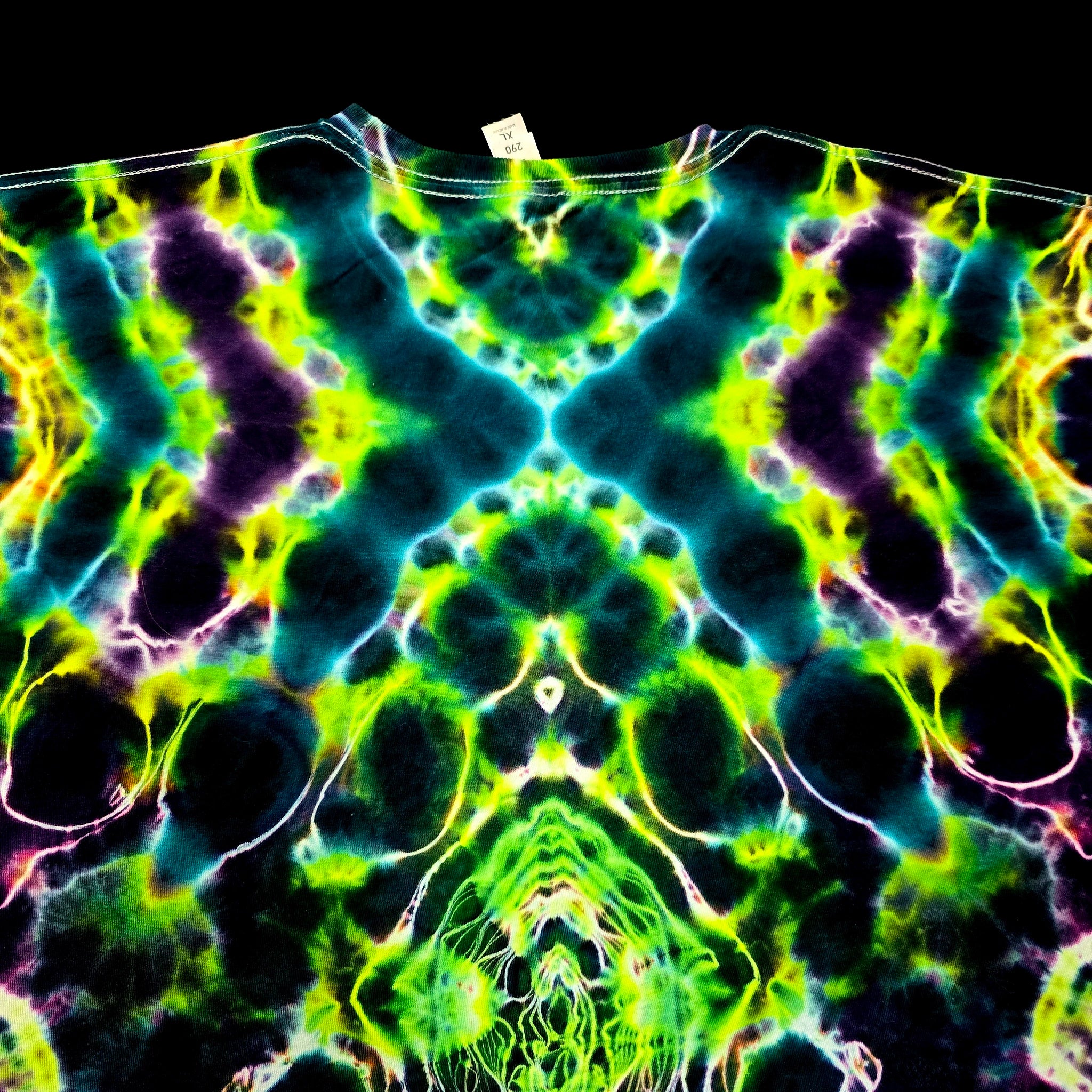 Colorful tie-dye pattern on a garment with a black background