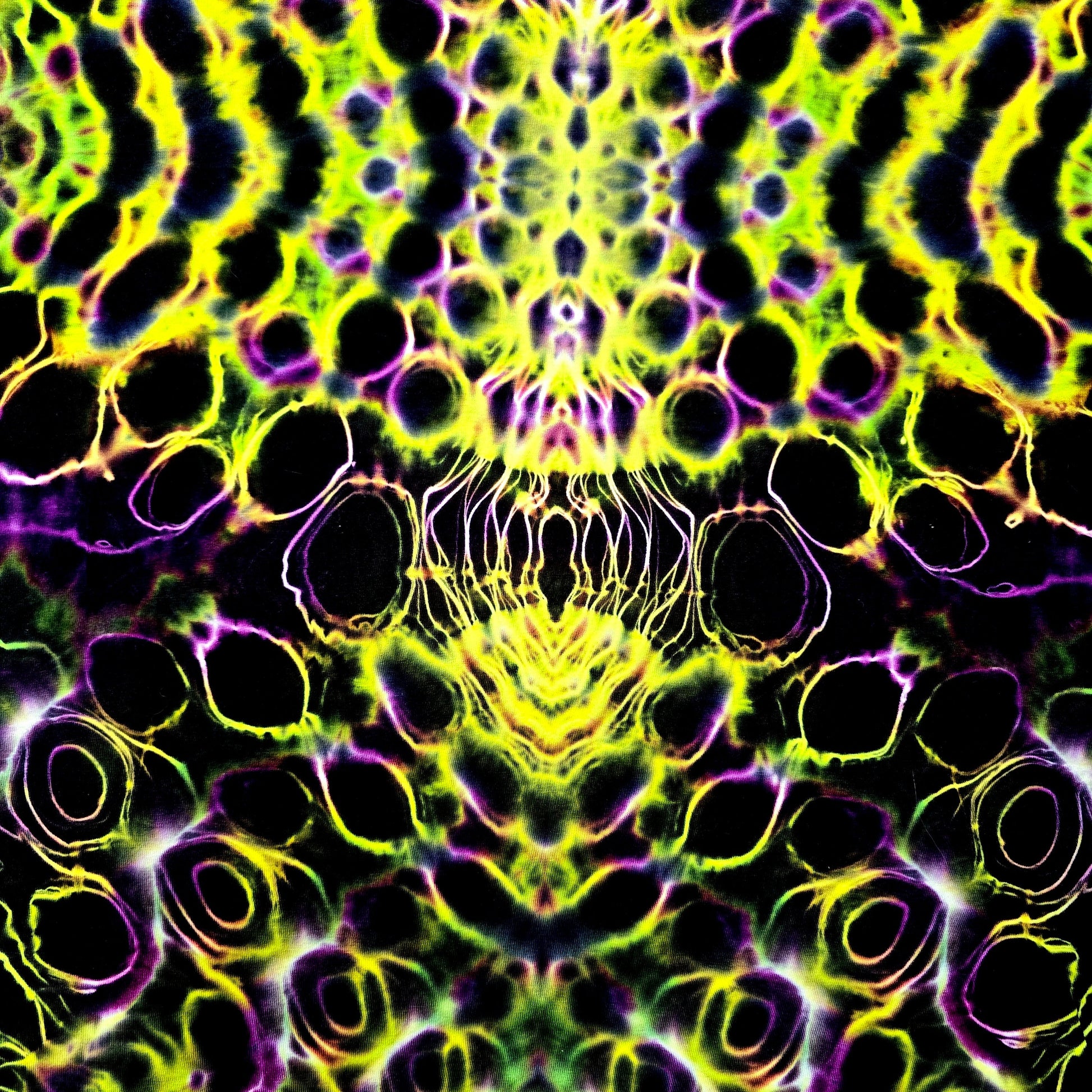 Mandala pattern with black, yellow, and purple colors on a black background