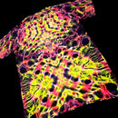 A short-sleeve crewneck t-shirt featuring a vibrant neon tie-dye pattern with bright yellow, pink, and purple swirls over a black base, shown against a solid black background.