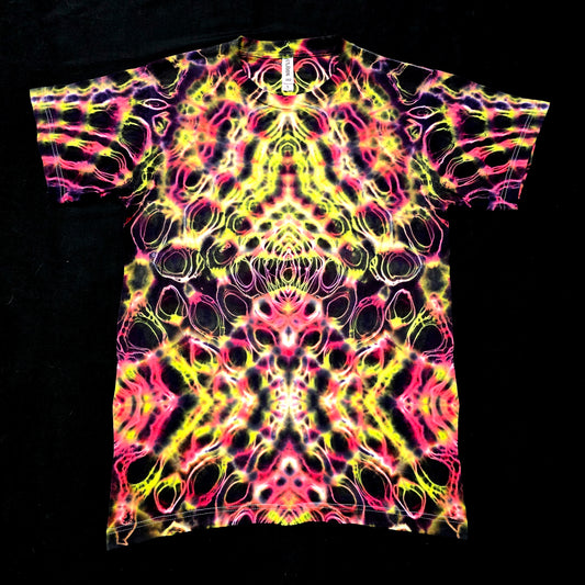 Handmade neon tie-dye shirt with mirrored psychedelic pattern on black fabric, front view