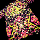 A short-sleeve tie-dye t-shirt with a vibrant neon pattern of pink, yellow, and green on a black background, shown against a solid black backdrop.