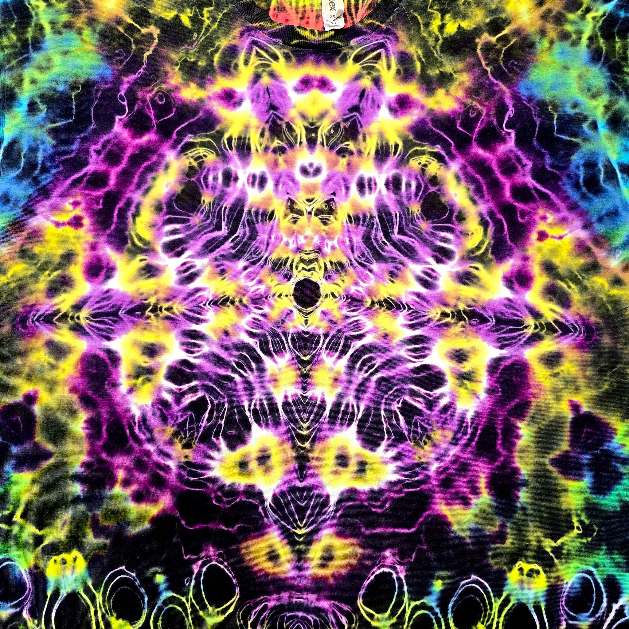 A highly vibrant, psychedelic tie-dye pattern with a symmetrical, kaleidoscopic design. The colors include neon purple, magenta, bright yellow, lime green, and deep black in a complex, fluid splatter pattern.