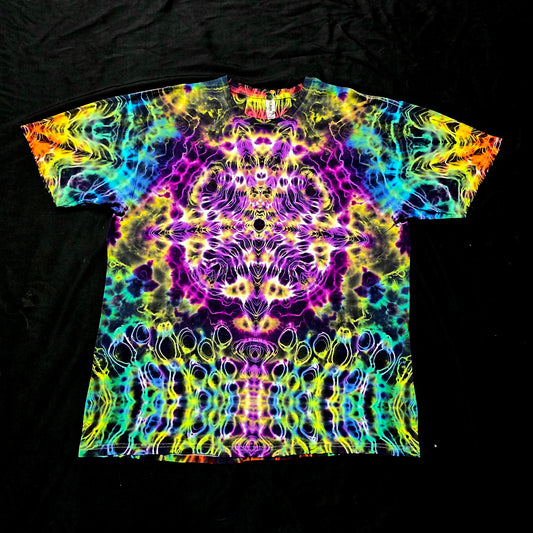 Front view of Prism Core handmade tie-dye tee featuring a mirrored rainbow fractal pattern on a black cotton shirt