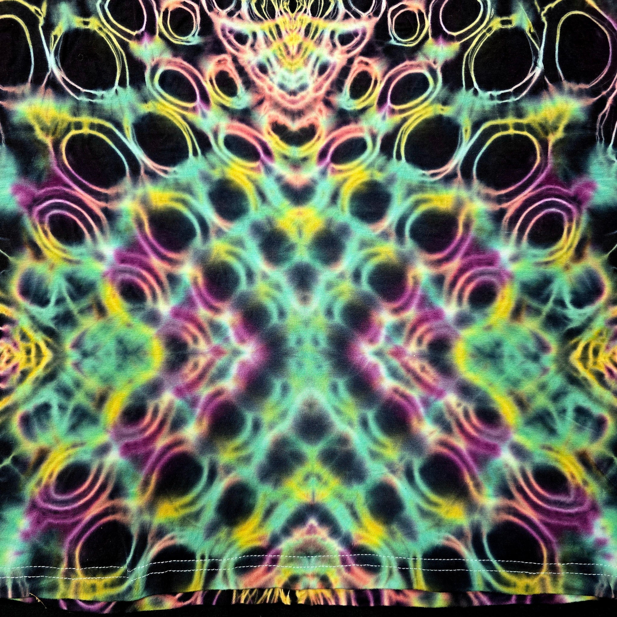 Multicolored tie-dye pattern with black background