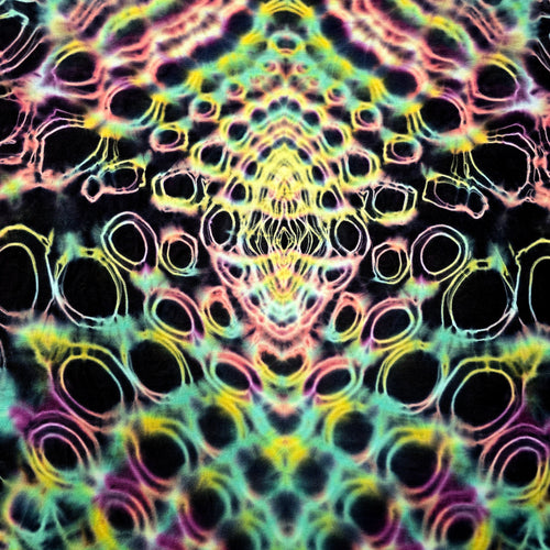 Close-up of back middle tie-dye pattern featuring dense circular dye cells with neon outlines and dark negative space
