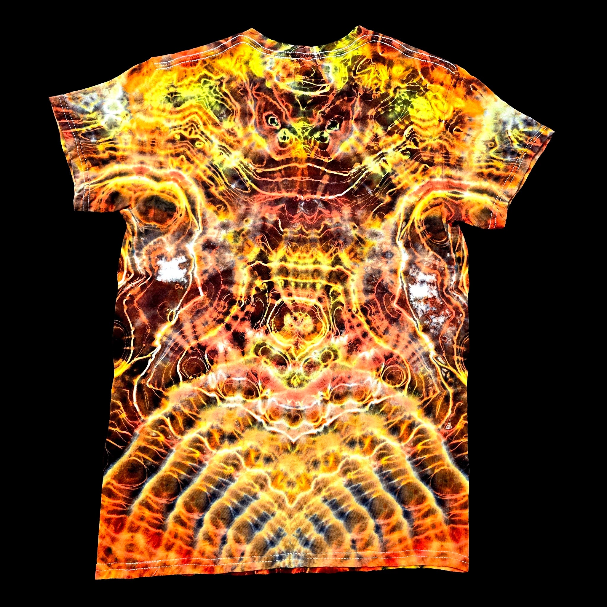A short-sleeve crewneck t-shirt featuring a vibrant, symmetrical psychedelic flame-like pattern in yellow, orange, red, and black, displayed flat against a solid black background.