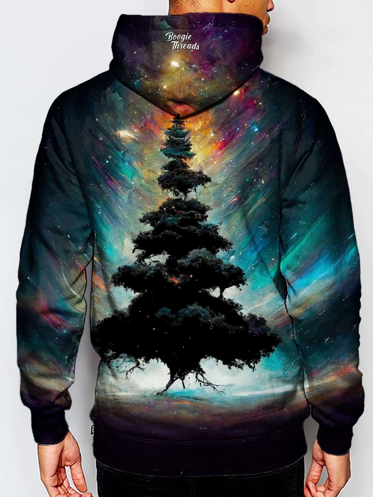 african american man wearin festival hoodie print - tree floating in front of bright nebula