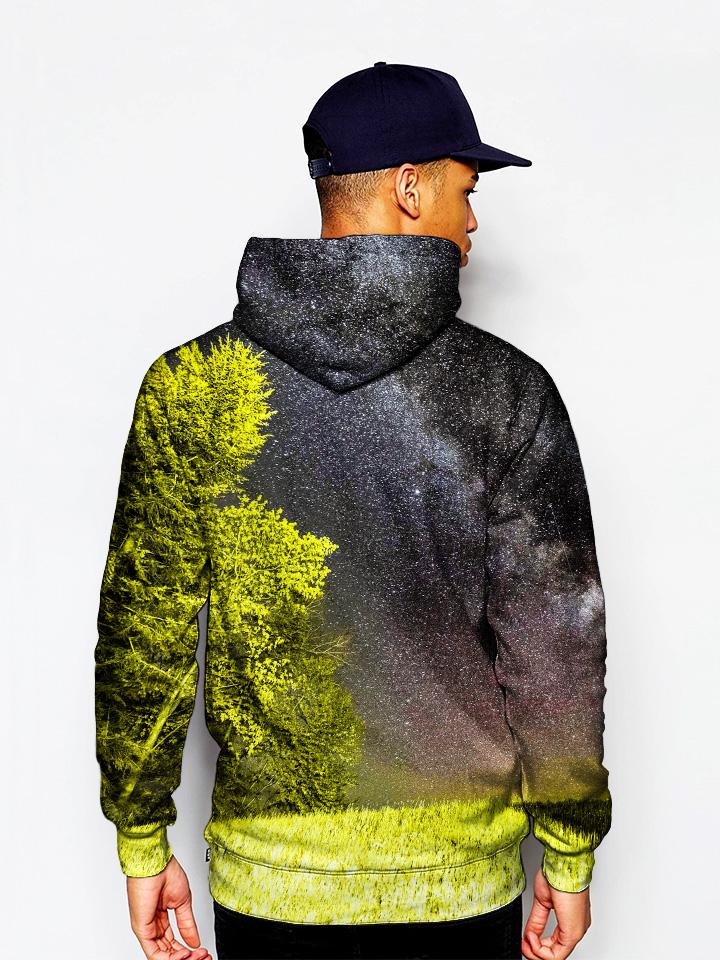 Model wearing GratefullyDyed Apparel forest galaxy pullover hoodie.