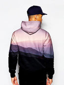 Model in mountain sunrise landscape all over print pullover hoodie