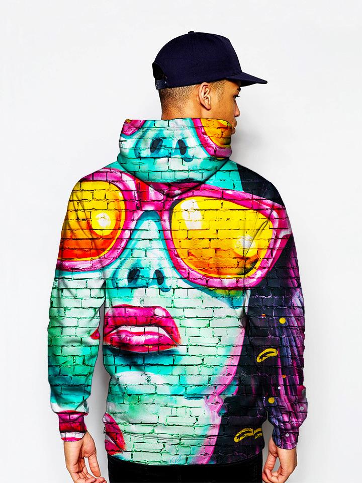 Model in urban mural on brick print pullover hoodie