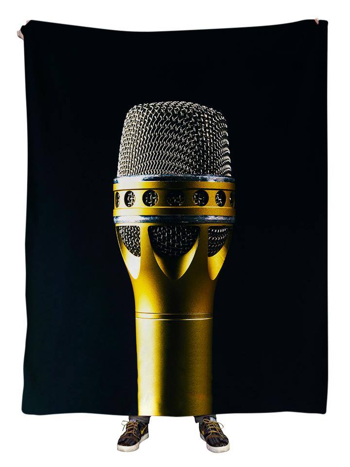 Hanging view of all over print black, brass & silver microphone blanket by GratefullyDyed Apparel.