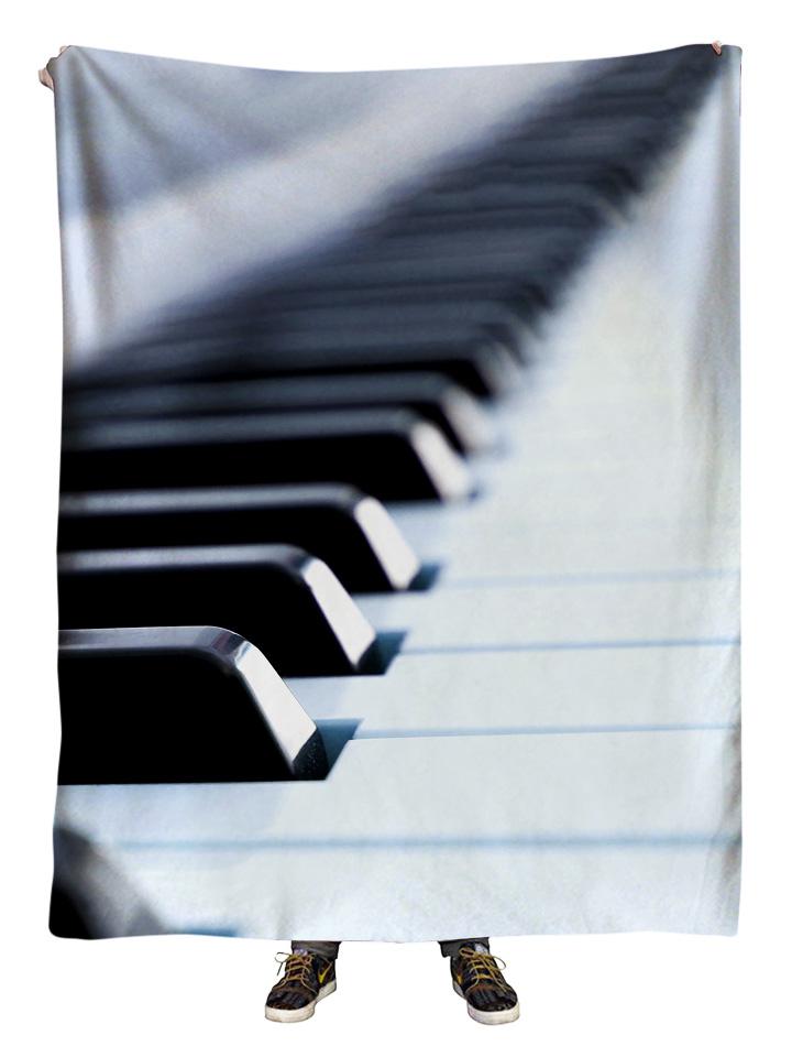Hanging view of all over print black & white piano blanket by GratefullyDyed Apparel.