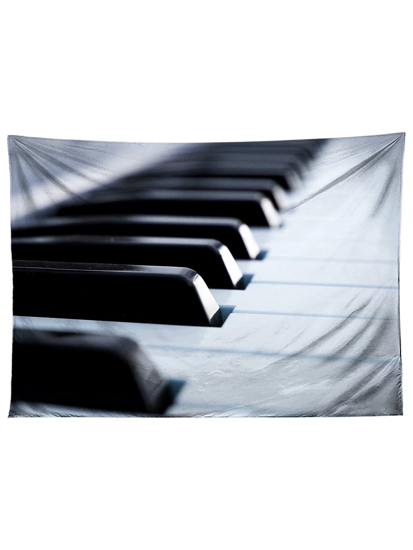Vertical hanging view of all over print black & white piano tapestry by GratefullyDyed Apparel.