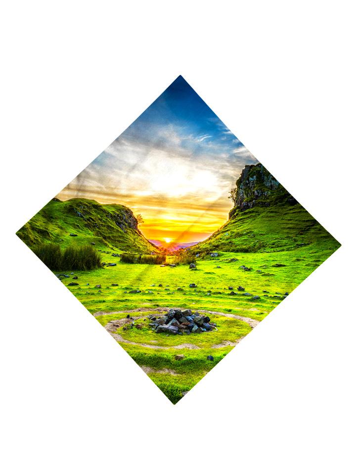 Sun setting behind green hills all over print bandana flat view