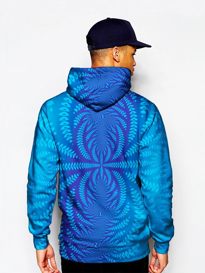 Model in blue pullover with trippy all over design