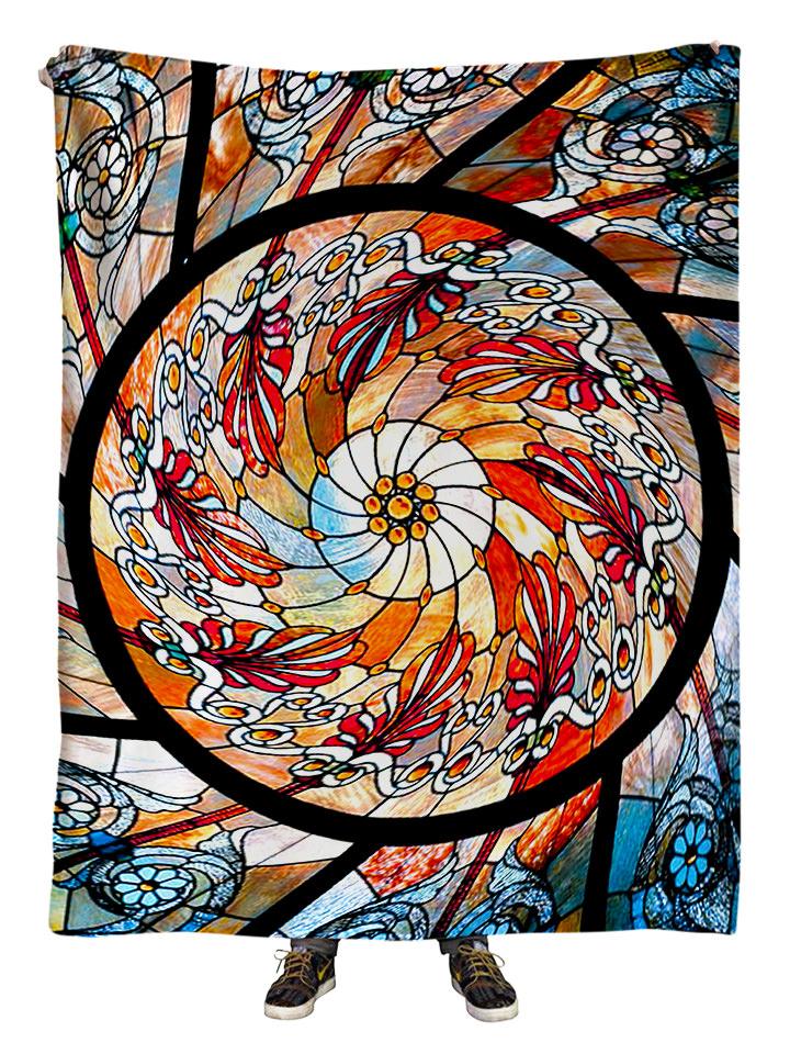 Hanging view of all over print red, orange & white stained glass mandala blanket by GratefullyDyed Apparel.