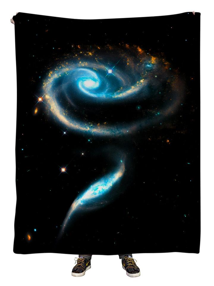 Hanging view of all over print blue & black spiral galaxy blanket by GratefullyDyed Apparel.