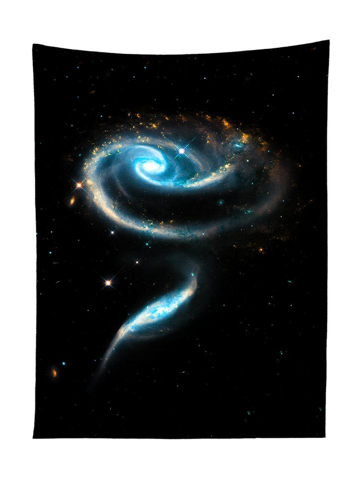 Vertical hanging view of all over print black & blue spiral galaxy tapestry by GratefullyDyed Apparel.