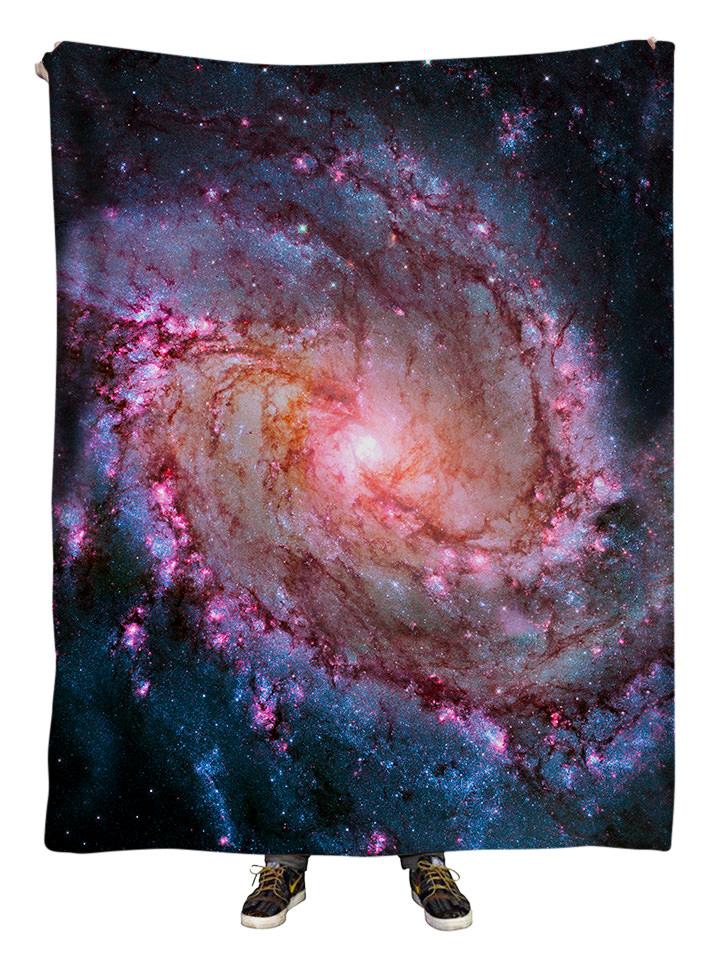 Hanging view of all over print pink spiral galaxy blanket by GratefullyDyed Apparel.